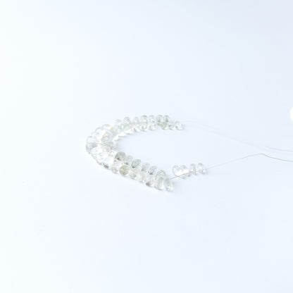 Handmade jewellery components crafted from Green Amethyst briolette beads with luminous clarity and sparkle.