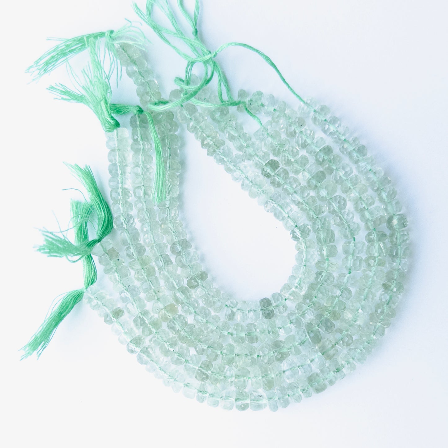 Green Amethyst faceted rondelle beads in 5.5–6.5mm size on a 16cm strand, showcasing genuine gemstone sparkle for handmade jewellery.