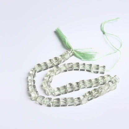 Close‑up of green amethyst smooth cube beads highlighting their glossy finish and natural gemstone clarity.