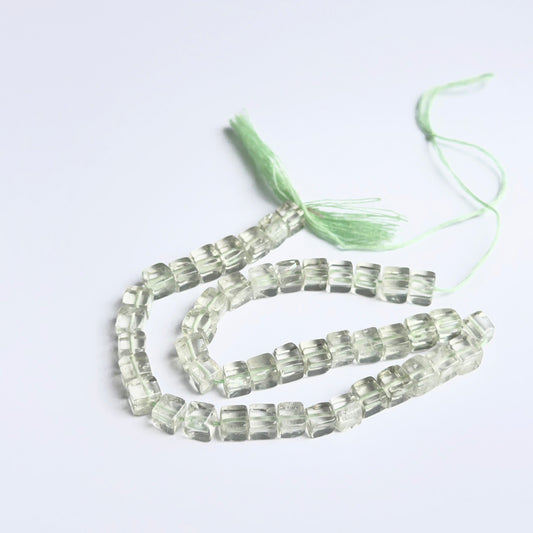 Close‑up of green amethyst smooth cube beads highlighting their glossy finish and natural gemstone clarity.