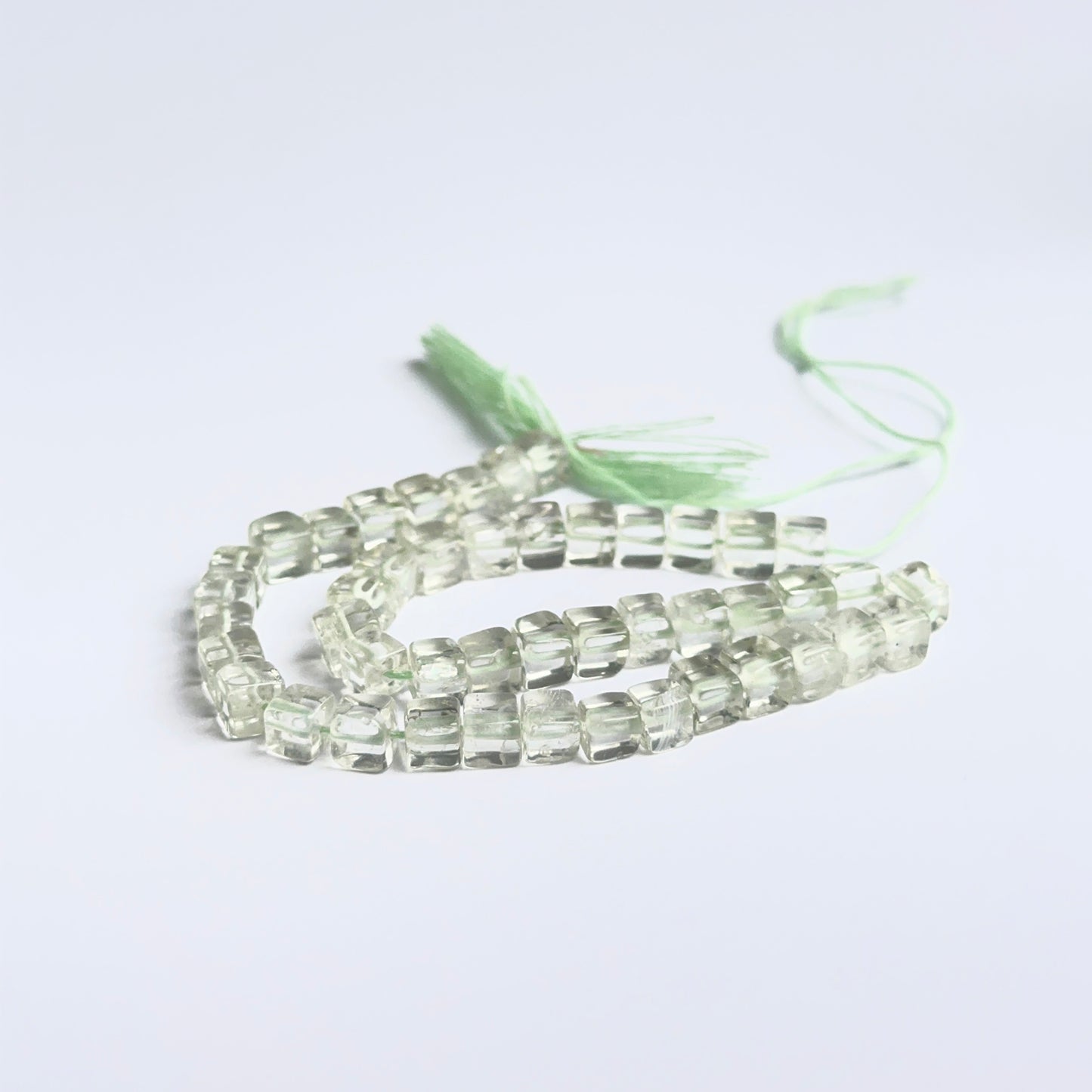 Smooth cube green amethyst beads displayed with clean surfaces ideal for gemstone jewellery making.