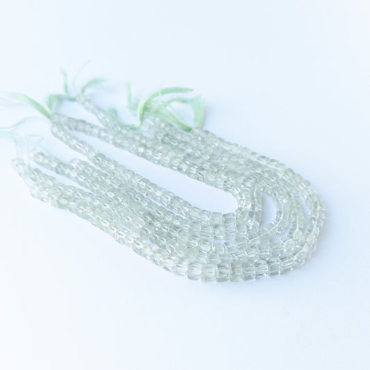 Green Amethyst smooth cube gemstone beads 4.2–4.5mm arranged in a soft green 20cm strand for jewellery making.
