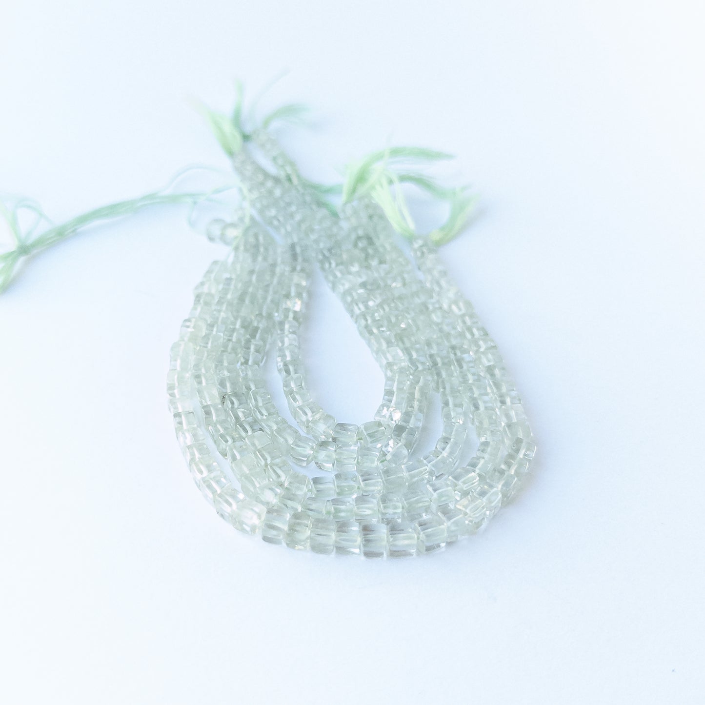 Natural Green Amethyst smooth cube beads showing pale green tones and uniform 4.2–4.5mm sizing for DIY jewellery.