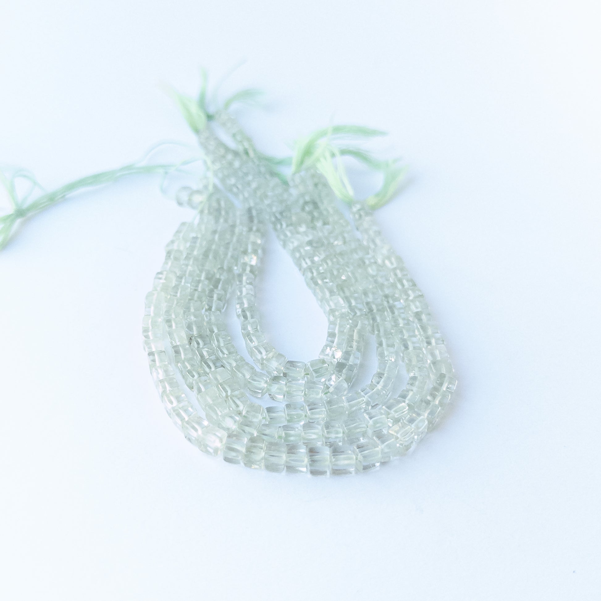 Natural Green Amethyst smooth cube beads showing pale green tones and uniform 4.2–4.5mm sizing for DIY jewellery.