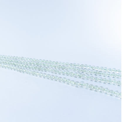 Authentic Green Amethyst gemstone beads showcasing gentle green colour, smooth round shaping and premium bead quality for jewellery designers.