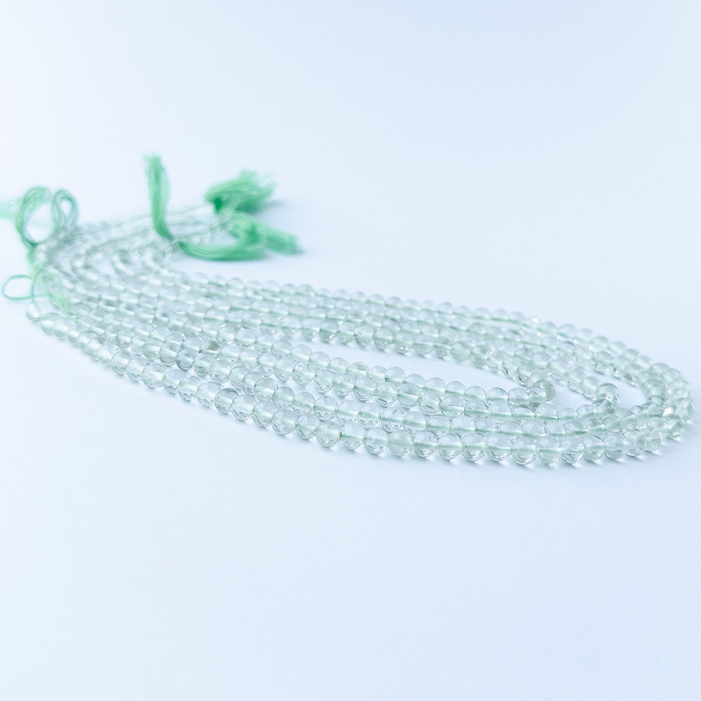 Genuine Green Amethyst smooth round stone beads with polished surfaces ideal for gemstone beads for DIY jewellery making.