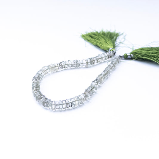 Close‑up of Green Amethyst smooth wheel beads with gentle shine and even shaping.