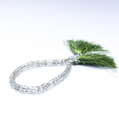 Smooth wheel‑cut Green Amethyst beads showing soft glow and refined cutting.