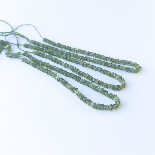 Green Apatite smooth heishi gemstone beads in 3.4–3.6mm size arranged on a 20cm or 42cm strand for jewellery making.