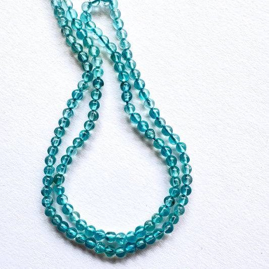Green Apatite stone beads with smooth round cut and consistent shine, perfect for DIY jewellery projects.