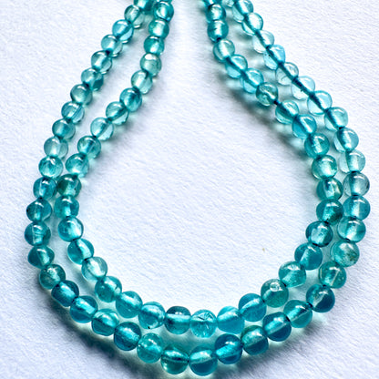 Handmade jewellery components featuring polished Green Apatite beads with 0.4mm drilled holes.