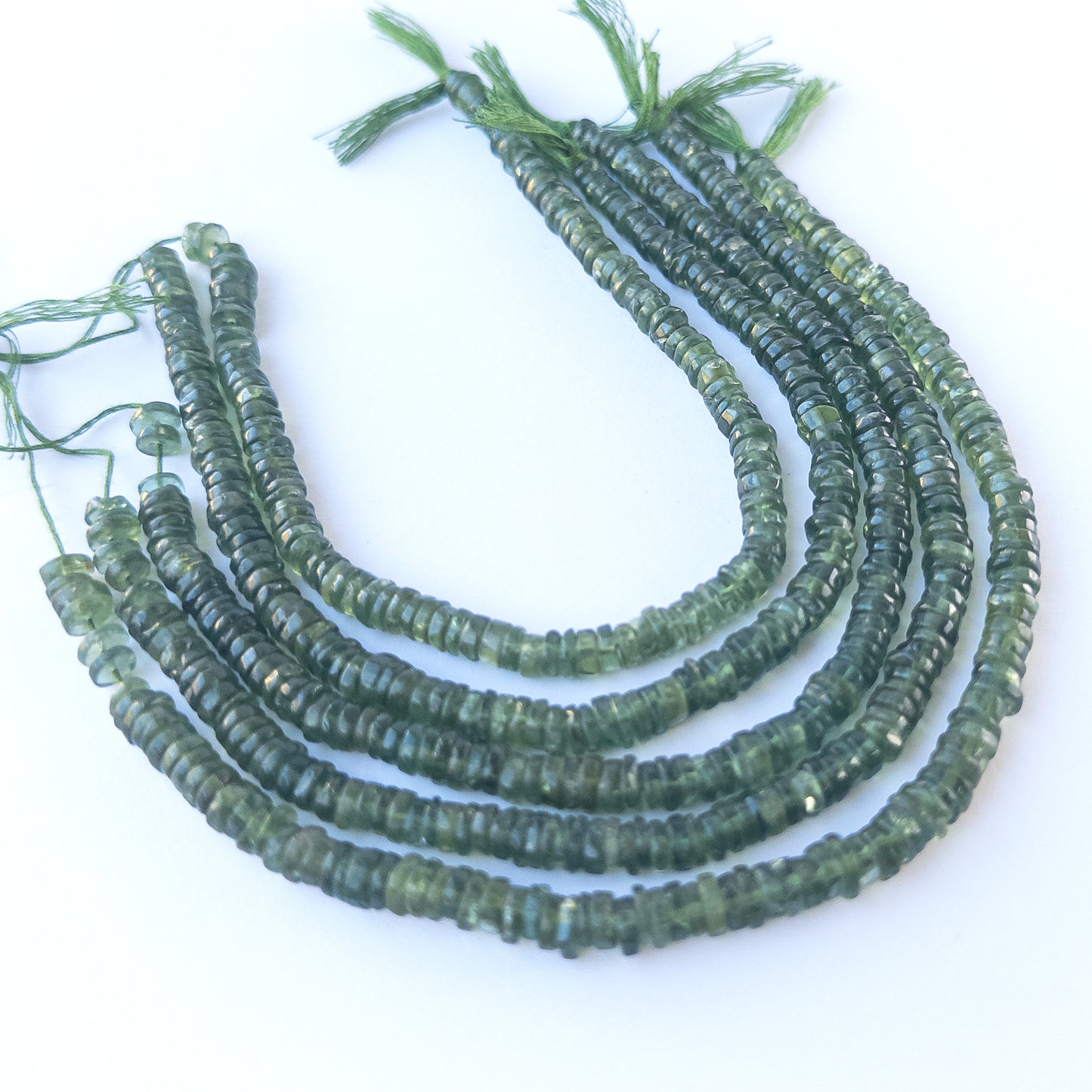 High‑quality Green Apatite smooth wheel beads in 5.3–5.5mm size offering clarity and shine for artisan jewellery projects.