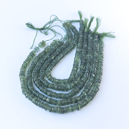 Authentic Green Apatite gemstone beads showcasing lively colour, smooth wheel shaping and premium bead quality for jewellery designers.