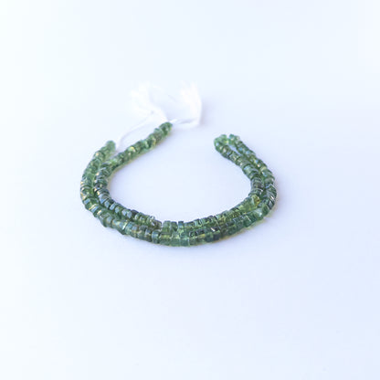 Green Apatite smooth wheel stone beads with uniform 4.5–4.6mm size and bright natural green tone.