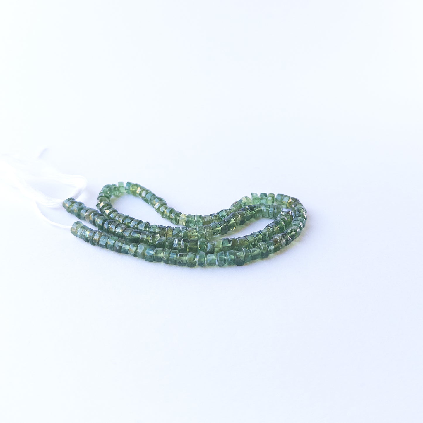 Genuine Green Apatite smooth wheel gemstone beads in a 34cm strand, ideal for handmade jewellery components.