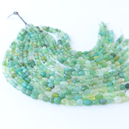 Genuine Green Chalcedony stone beads in faceted oval cut arranged on a 20cm strand.