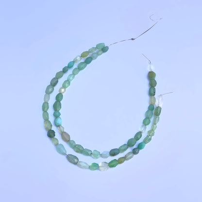 Green Chalcedony faceted oval beads in refreshing green tones strung on a 21cm strand.