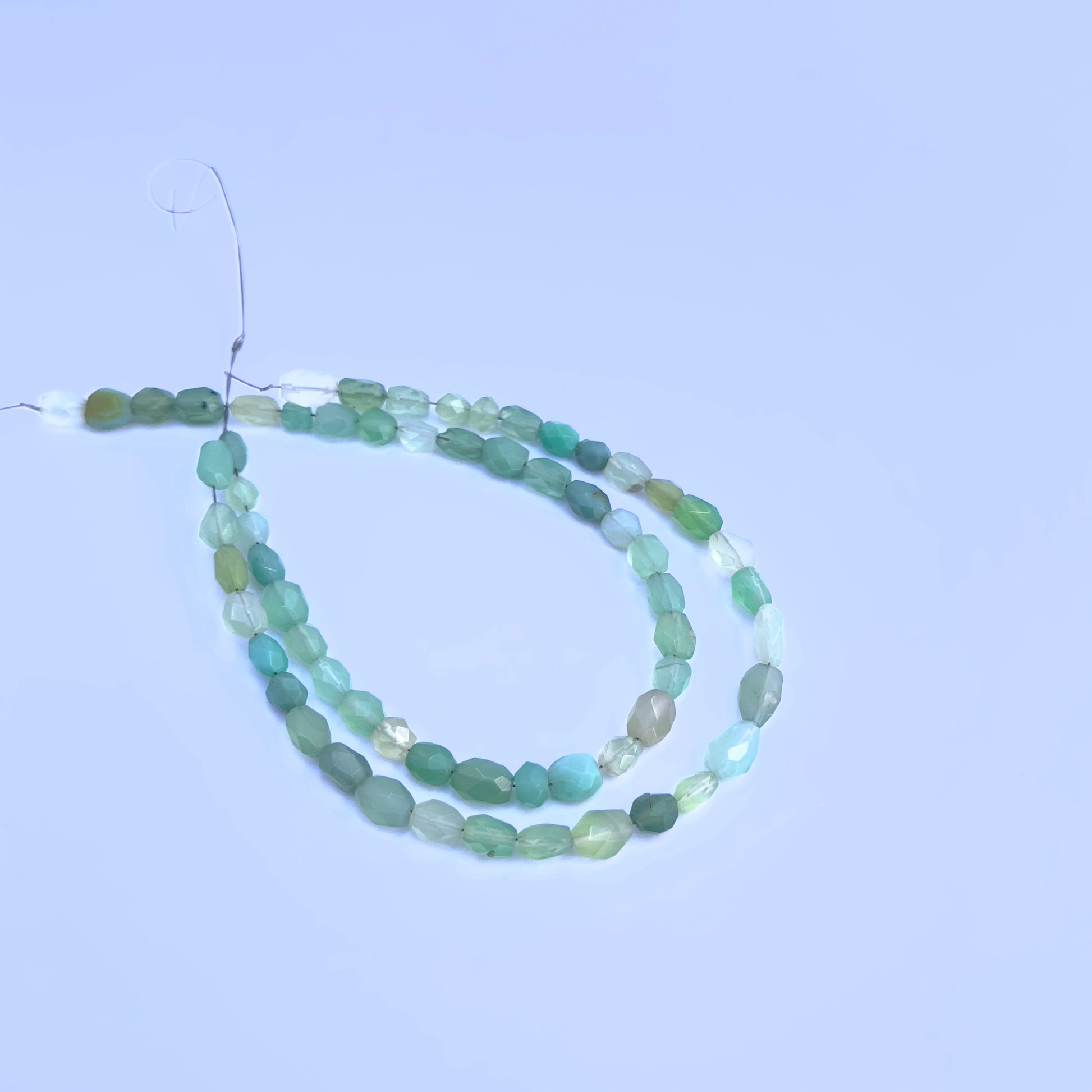 Handmade jewellery components featuring Green Chalcedony faceted oval beads.