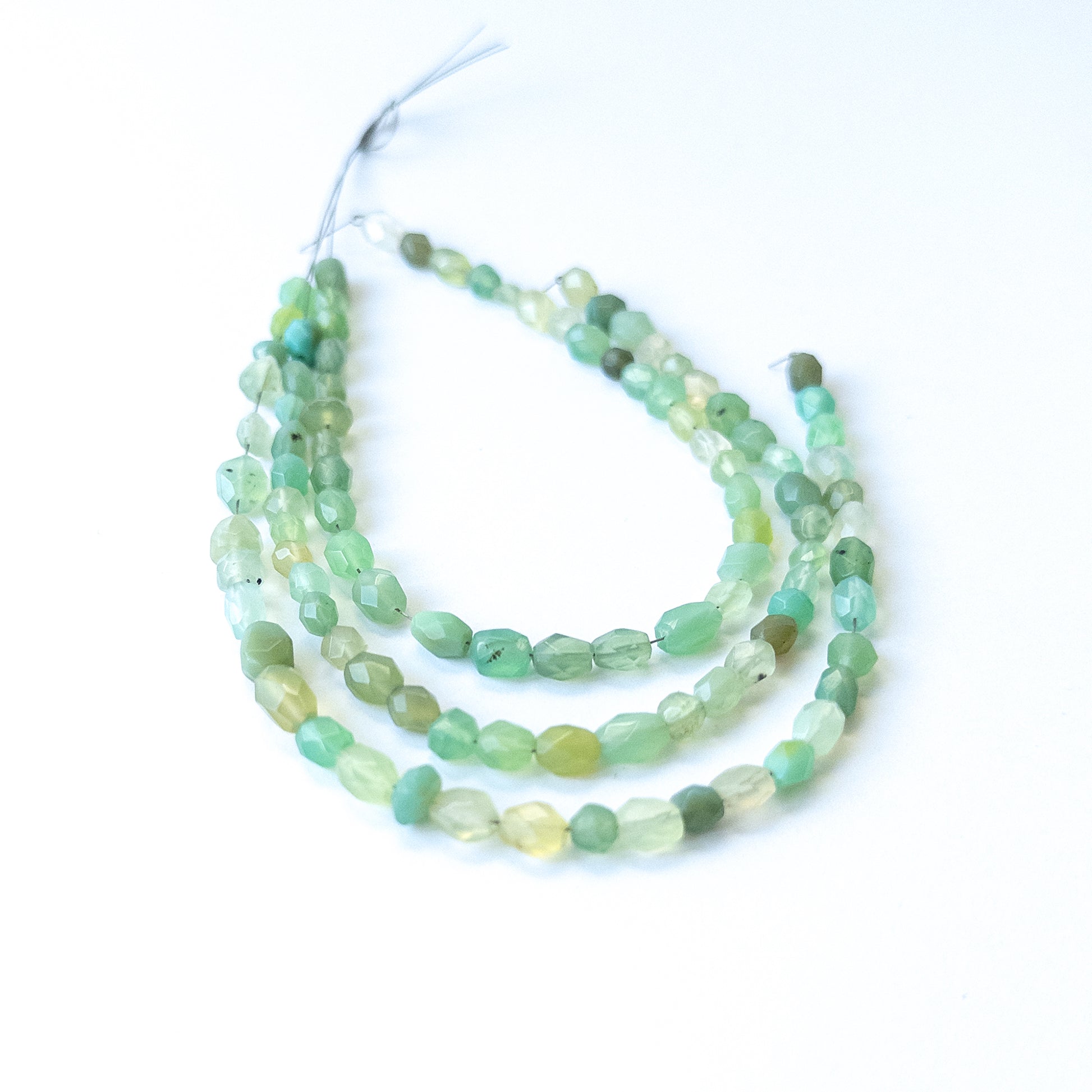 Handmade jewellery components using premium Green Chalcedony faceted ovals with bright shine and soft green tones.
