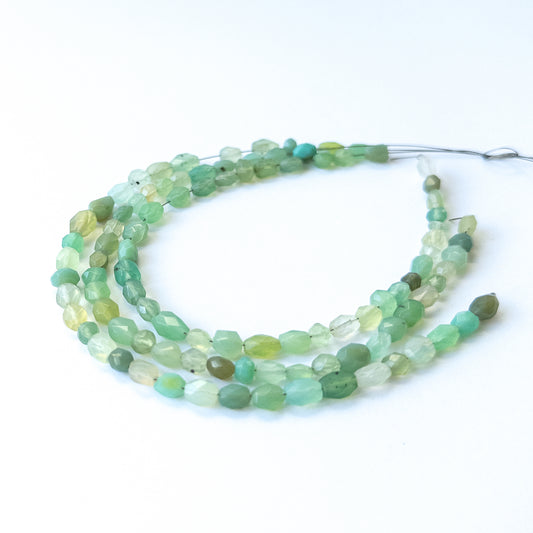 Natural Green Chalcedony stone beads with polished faceted oval shapes, perfect for artisan jewellery components.