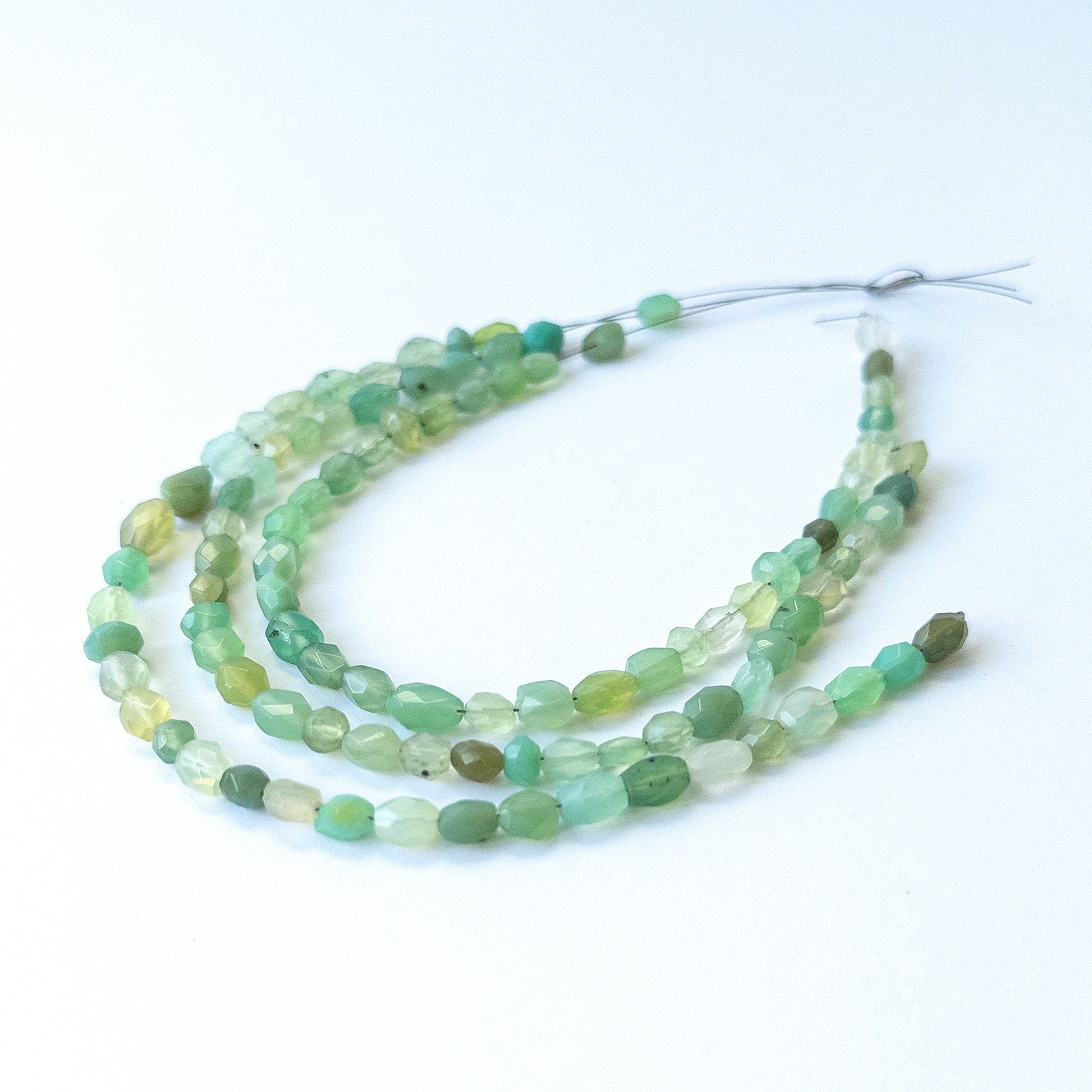 Authentic Green Chalcedony gemstone beads featuring sparkling faceted oval cuts ideal for DIY jewellery making