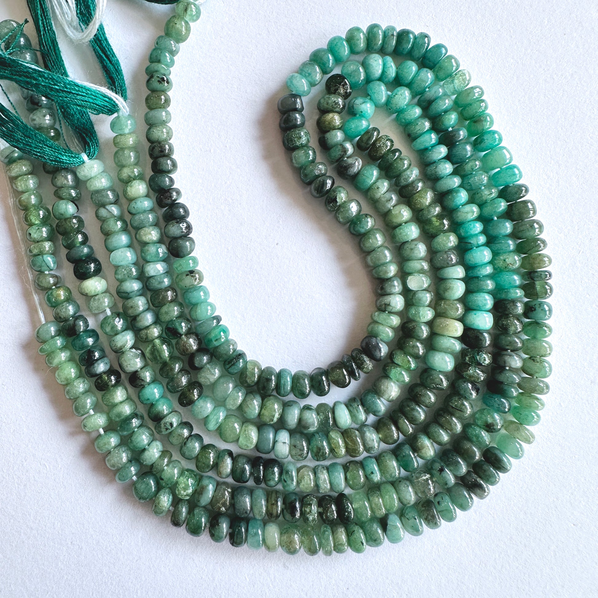 Stone Beads for DIY jewellery featuring Green Emeralds in consistent size and glossy texture.