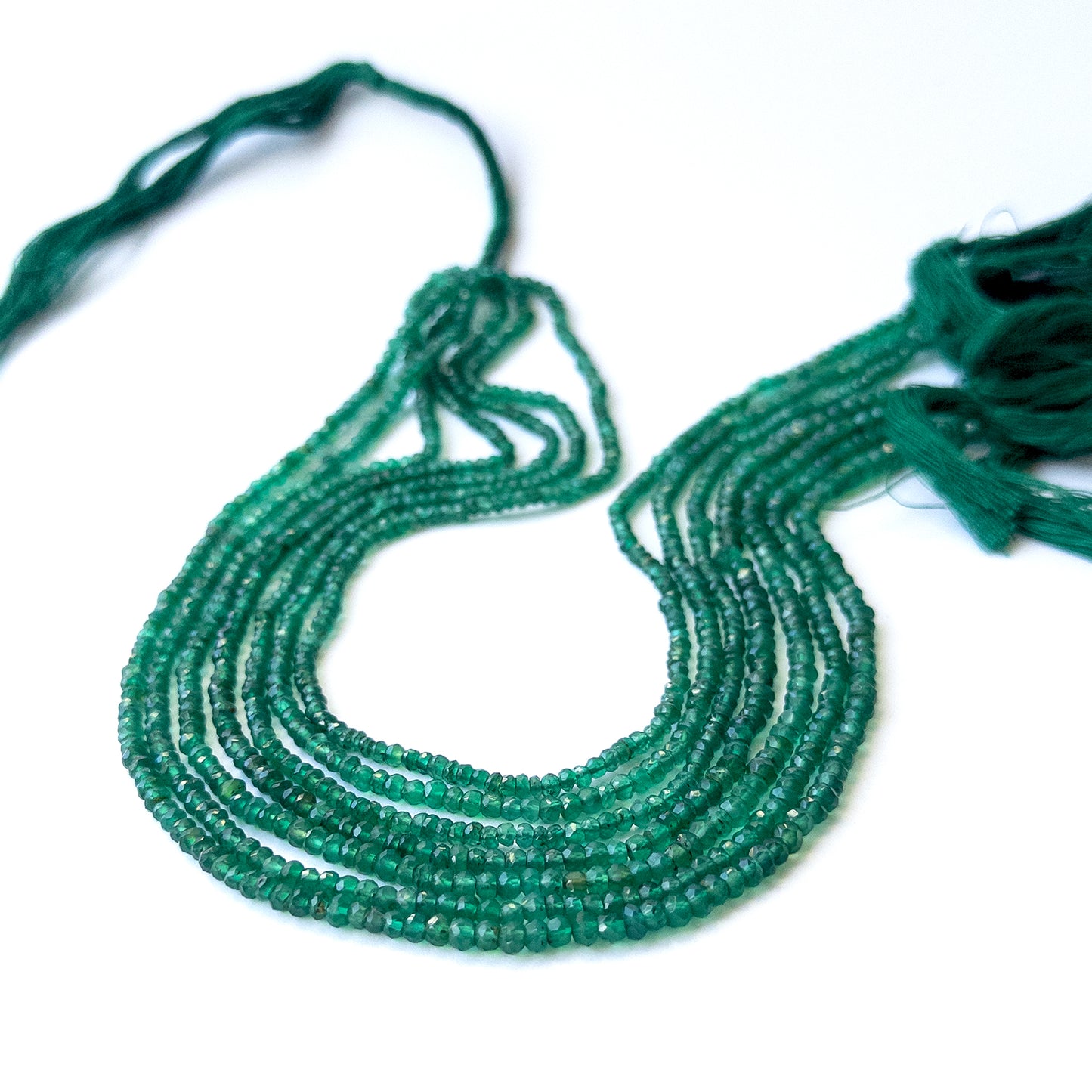 Natural Green Onyx stone beads with polished faceted rondelle shapes, perfect for artisan jewellery components.