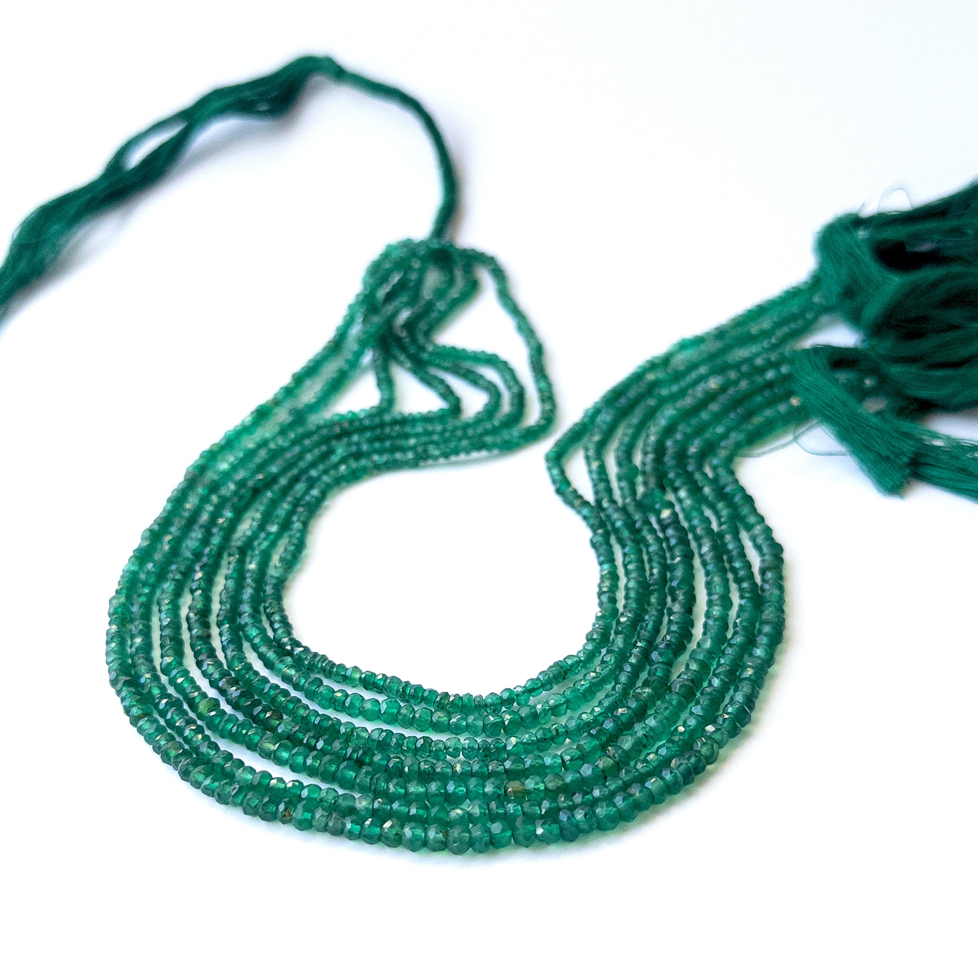 Natural Green Onyx stone beads with polished faceted rondelle shapes, perfect for artisan jewellery components.