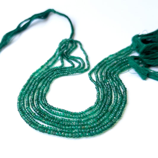 Natural Green Onyx stone beads with polished faceted rondelle shapes, perfect for artisan jewellery components.