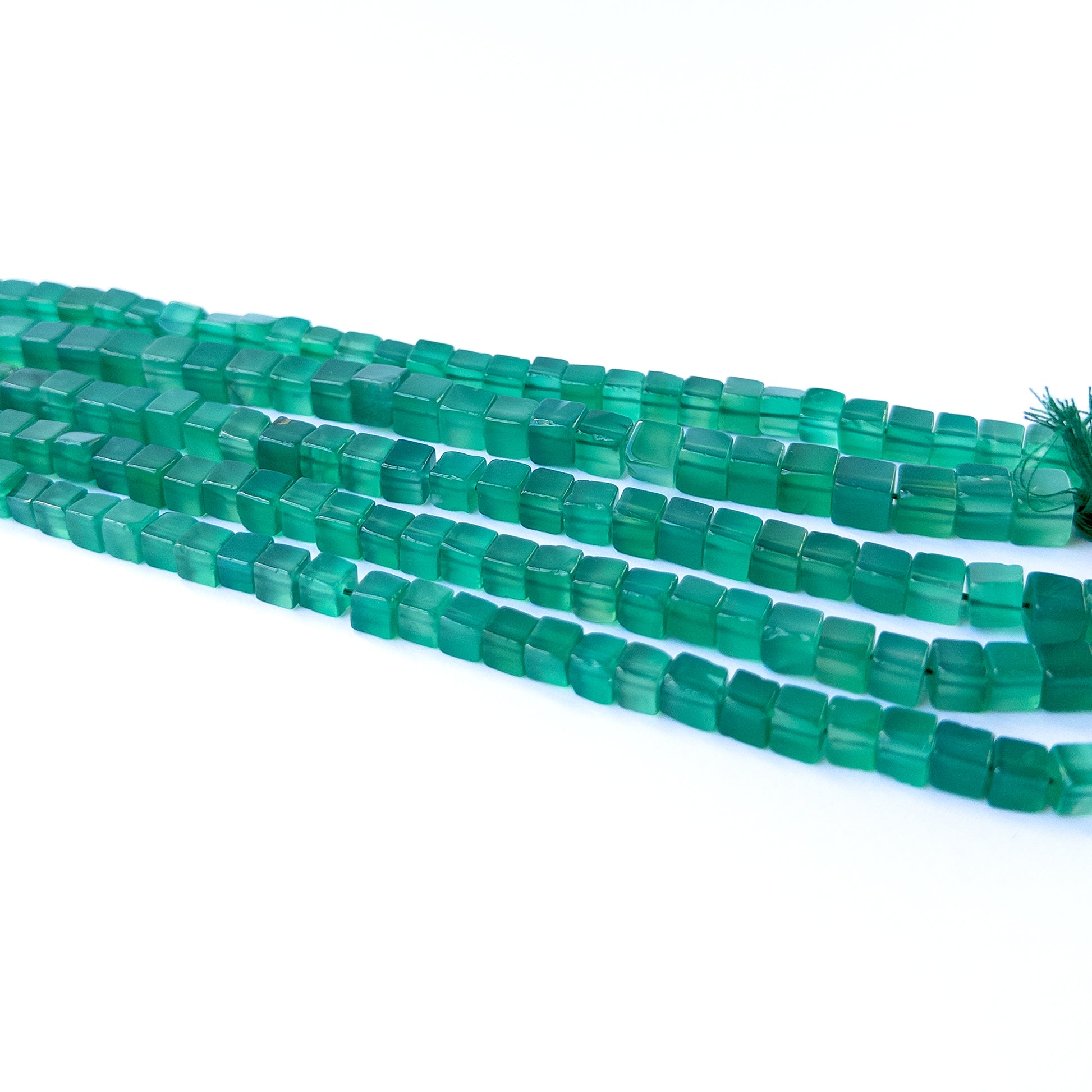 Vibrant green onyx beads in smooth cube cut, perfect for gemstone beads for DIY jewellery projects.