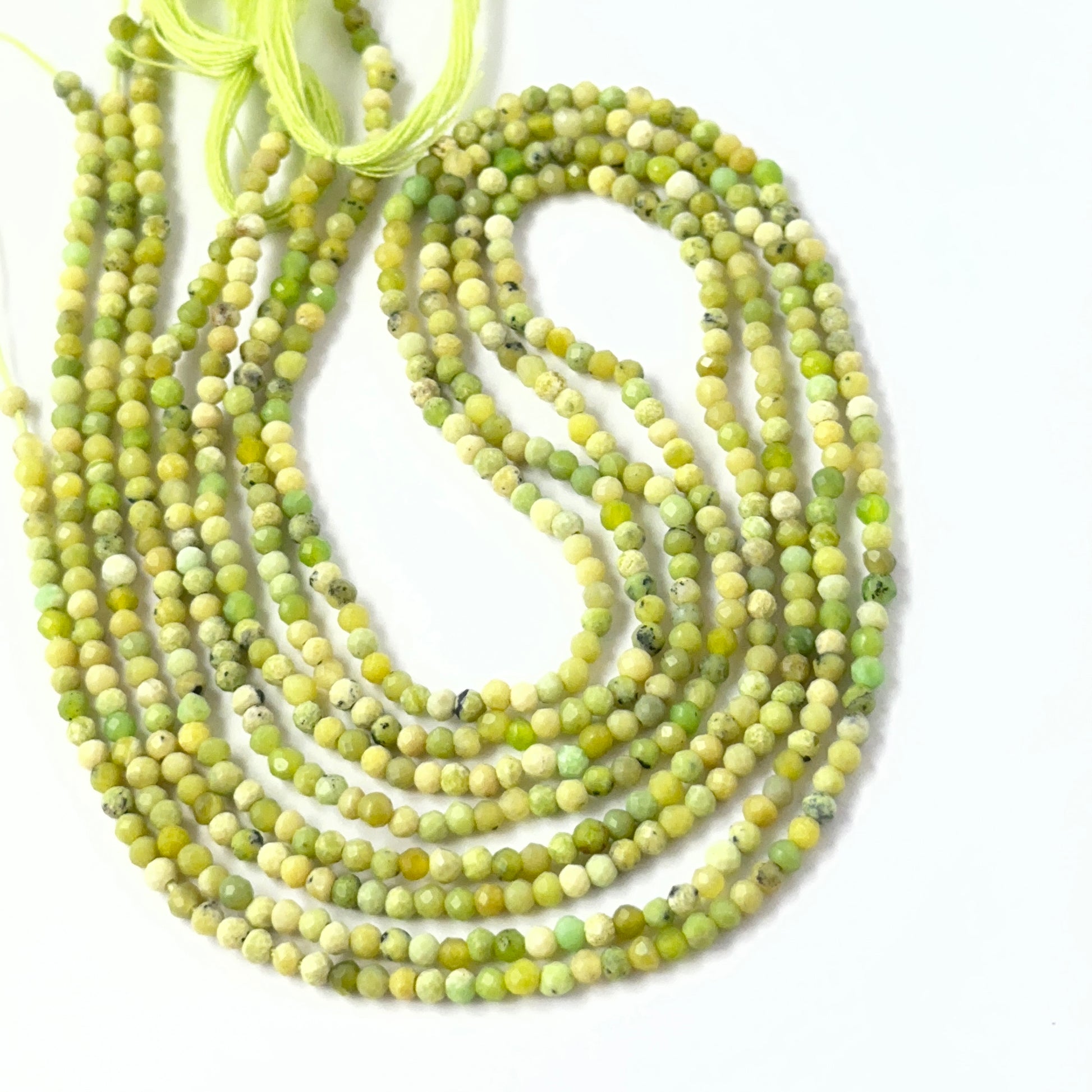 Authentic Green Opal faceted rondelle beads with natural texture and sparkle, ideal gemstone beads for professional jewellery.