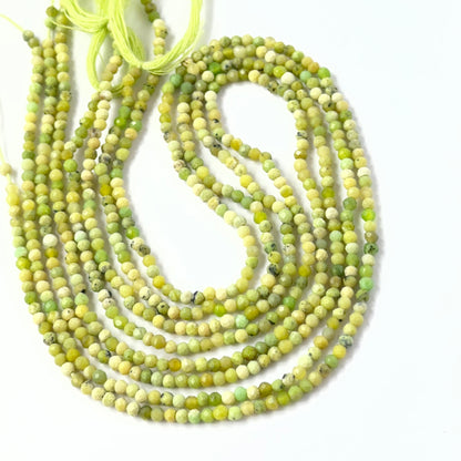 Authentic Green Opal faceted rondelle beads with natural texture and sparkle, ideal gemstone beads for professional jewellery.