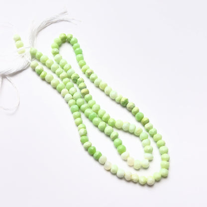 Close‑up of green opal 3.8–4mm faceted rondelle gemstone beads