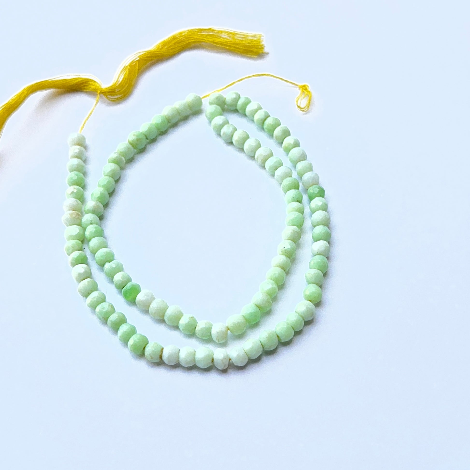 Green Opal faceted rondelle natural gemstone beads in 4.3–4.5mm on a 32cm strand, showing soft green sparkle for DIY jewellery.