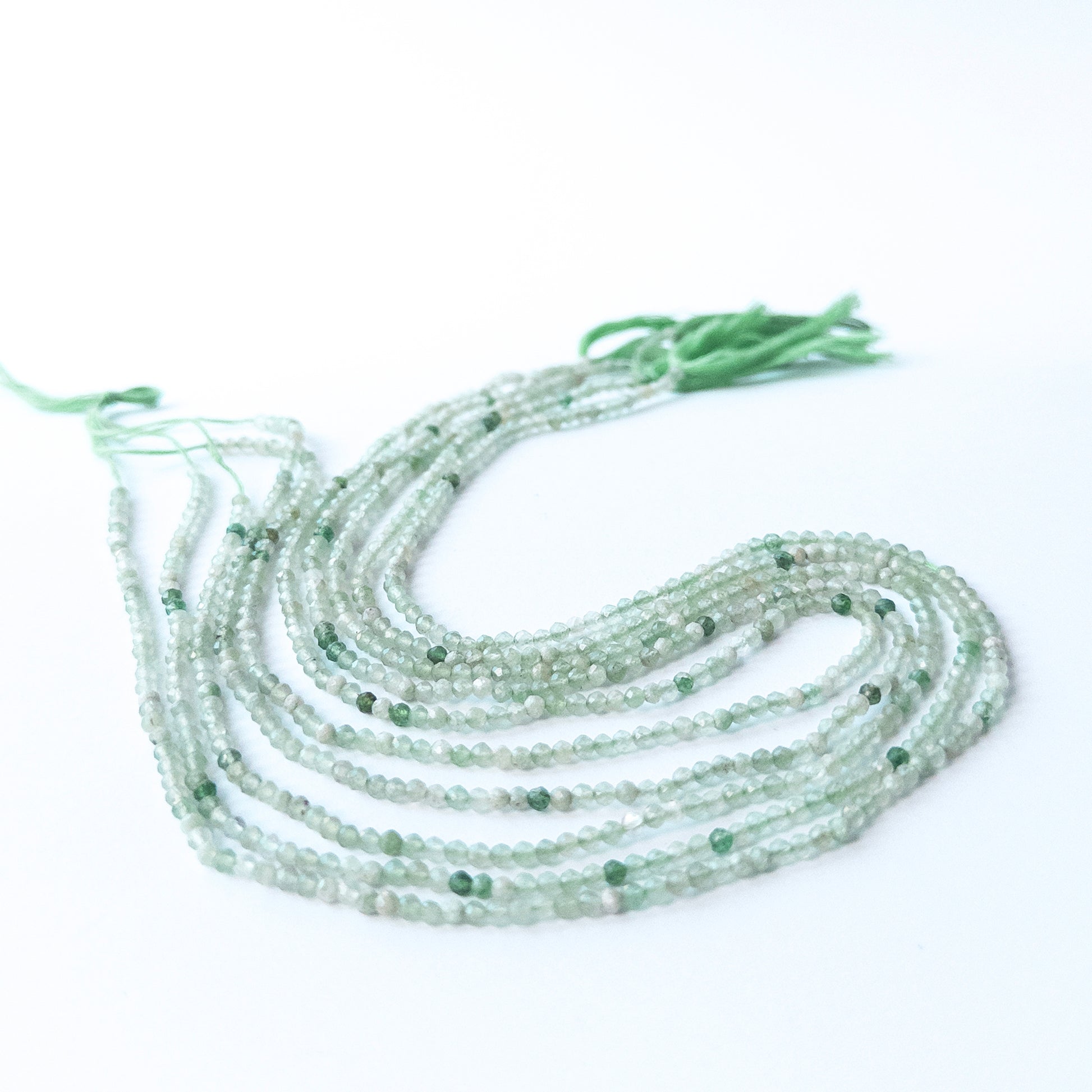 High‑quality Green Chalcedony rondelle beads arranged neatly for gemstone jewellery making.