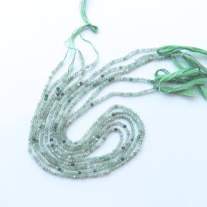 Delicate Green Shaded Chalcedony faceted rondelles showcasing shine and clarity for DIY gemstone designs.
