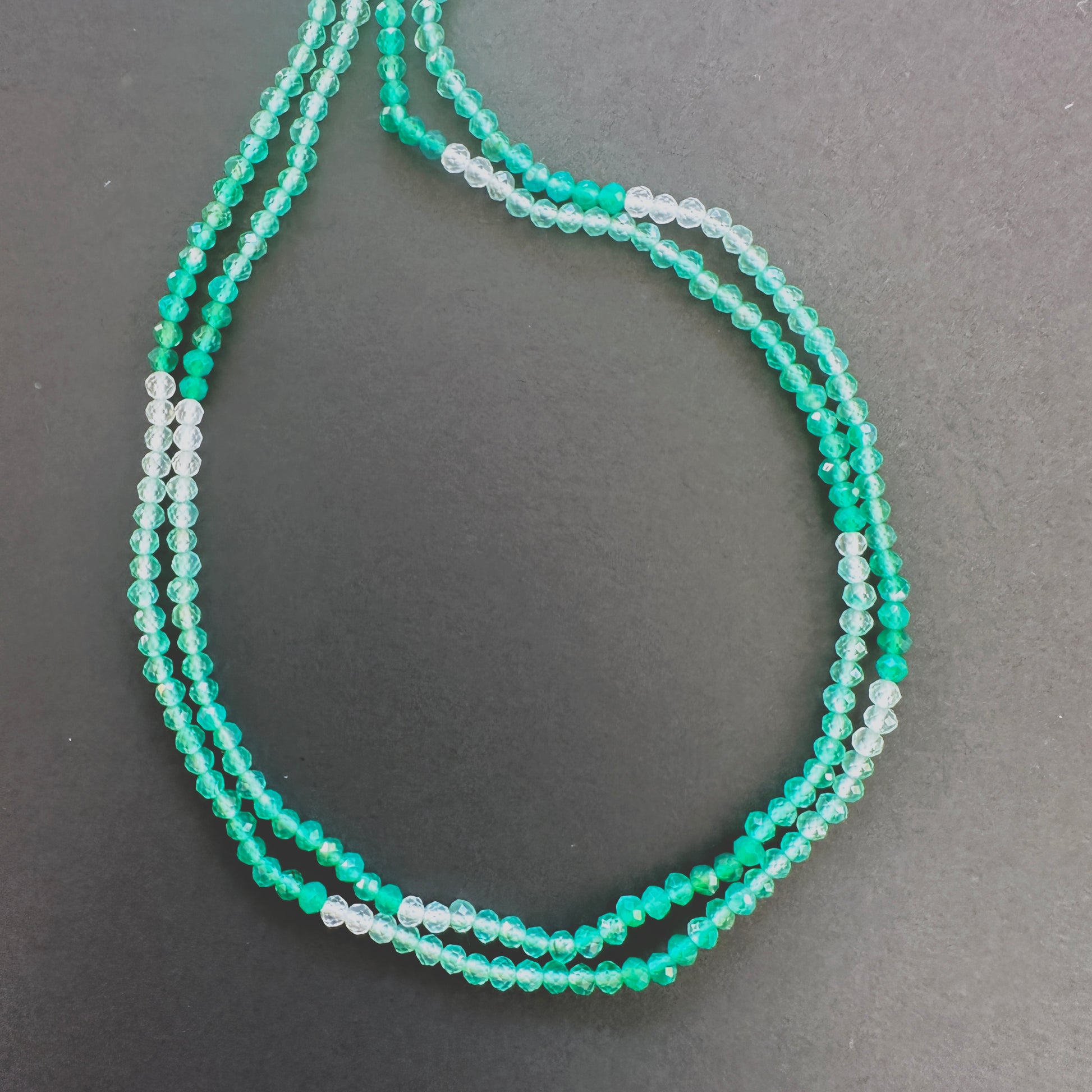 Natural gemstone beads in Green Shaded Onyx, arranged on a 32cm strand with consistent cut.