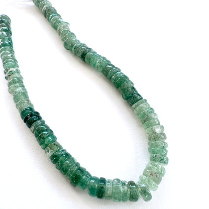 Green Strawberry Quartz stone beads with smooth wheel cut and natural inclusions.