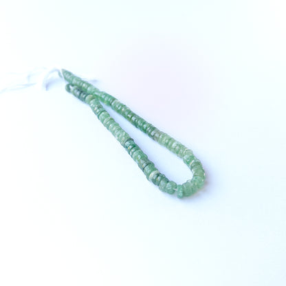 Green Strawberry Quartz smooth wheels displaying fresh green tones and premium bead craftsmanship.