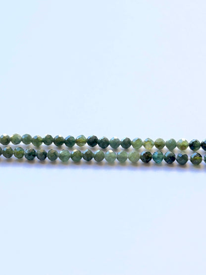 Green Tourmaline faceted sphere 3.5mm beads on a 32cm strand showing vivid green sparkle for jewellery making.
