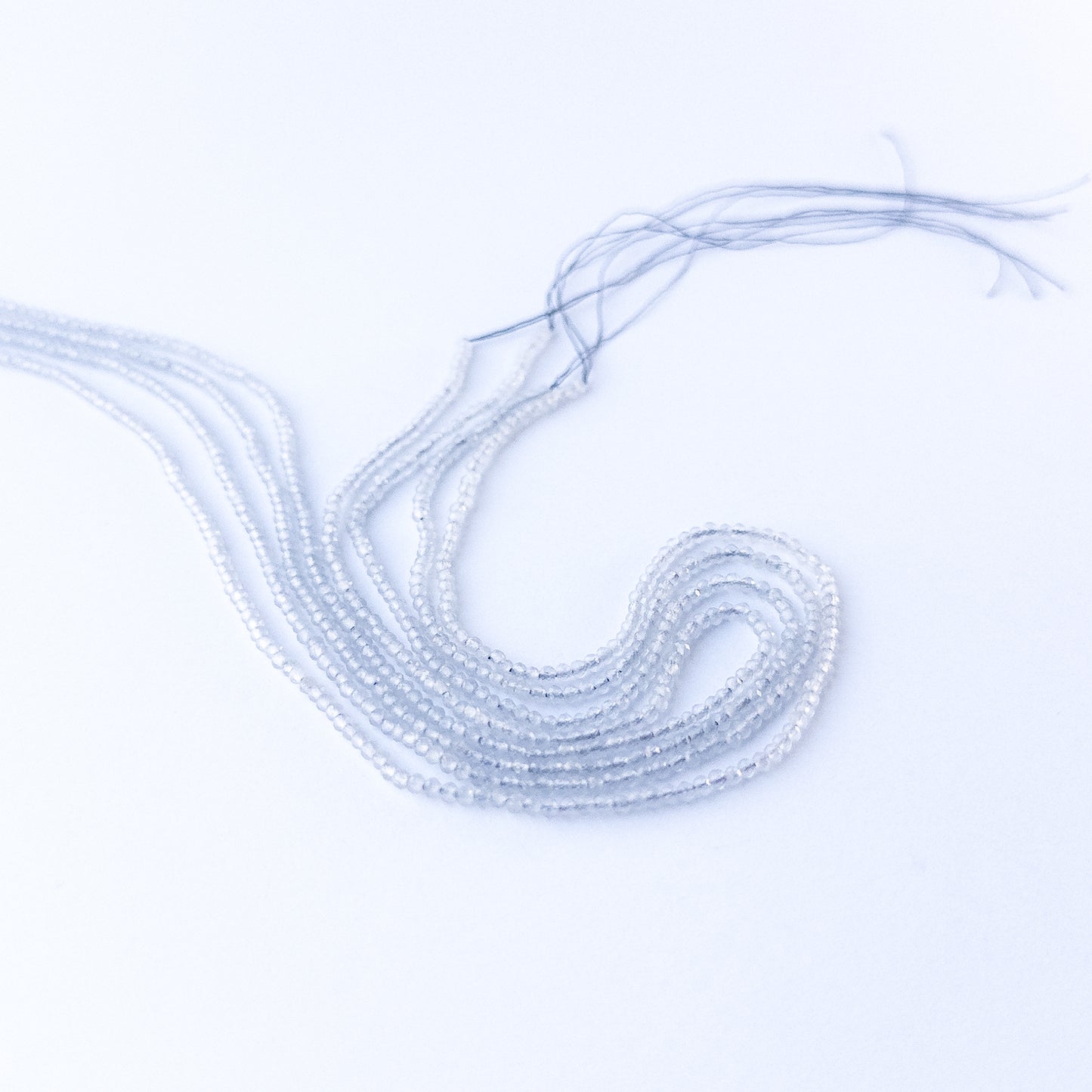 Grey Chalcedony faceted rondelle 2.2mm genuine gemstone beads arranged in a sparkling 35cm strand for handmade jewellery.