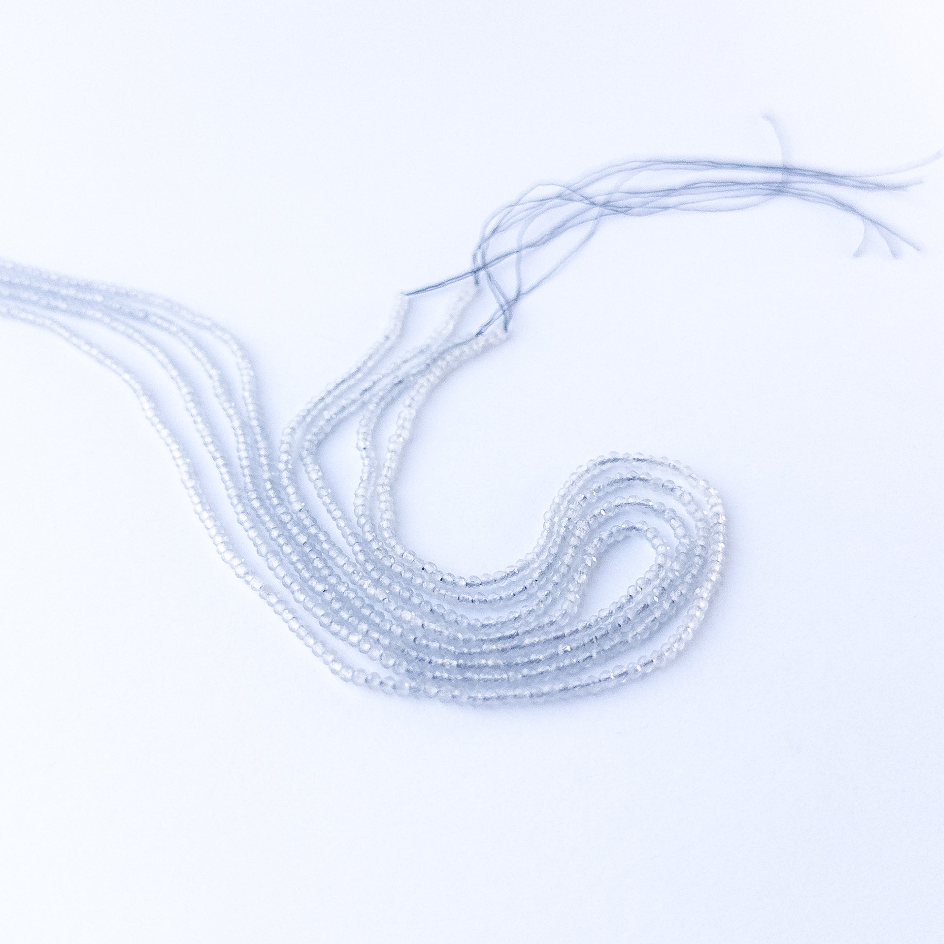 Grey Chalcedony faceted rondelle 2.2mm genuine gemstone beads arranged in a sparkling 35cm strand for handmade jewellery.