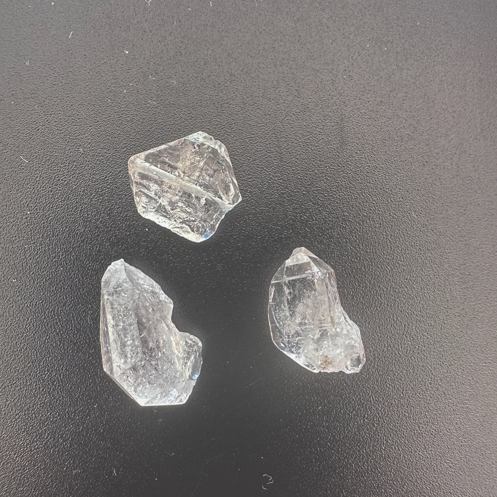 Three-piece Herkimer diamond set with high transparency and unique crystal shapes.