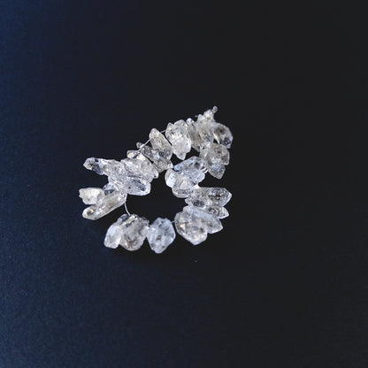 Handmade jewellery components featuring Herkimer Diamond rough beads with bright reflective surfaces.