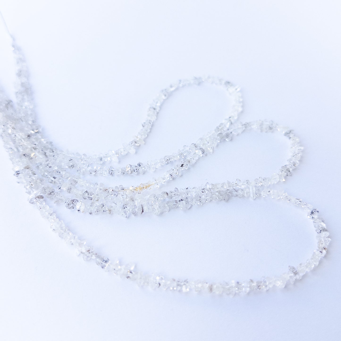 Handmade jewellery components featuring authentic Herkimer Diamond chip beads with bright reflective shine.
