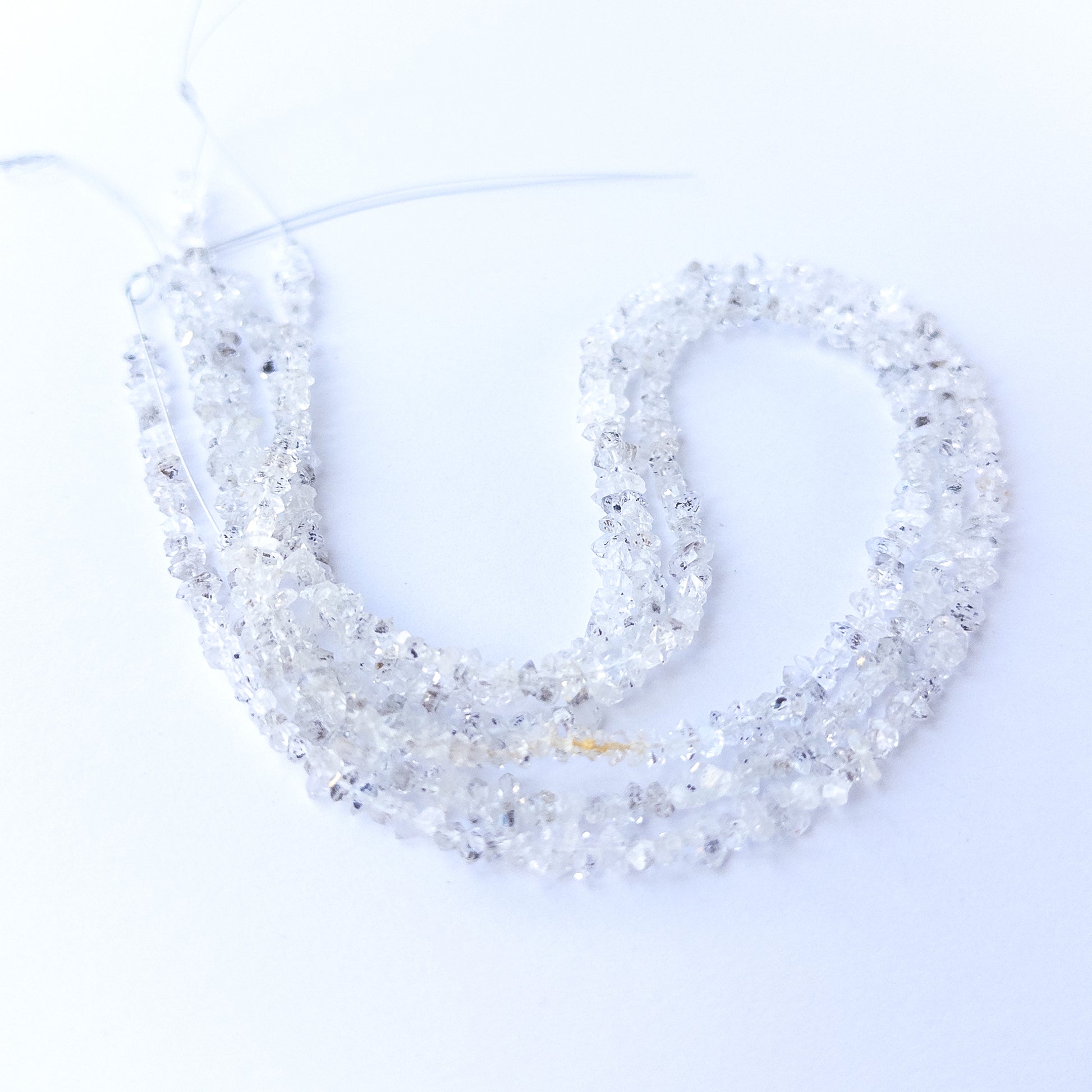 Natural Herkimer Diamond gemstone chip beads showing clear shine and raw crystal texture for DIY jewellery.