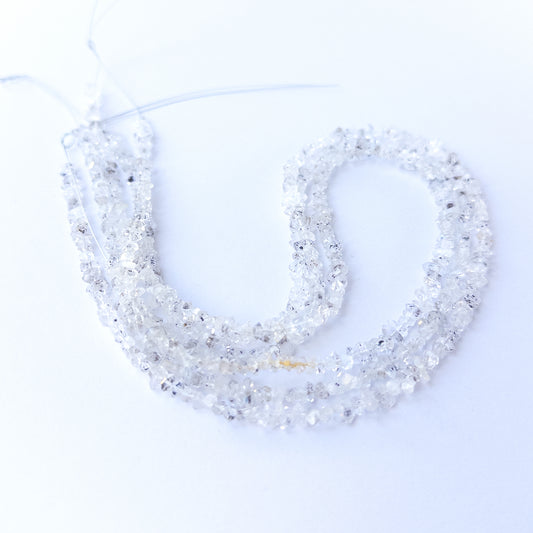 Natural Herkimer Diamond gemstone chip beads showing clear shine and raw crystal texture for DIY jewellery.