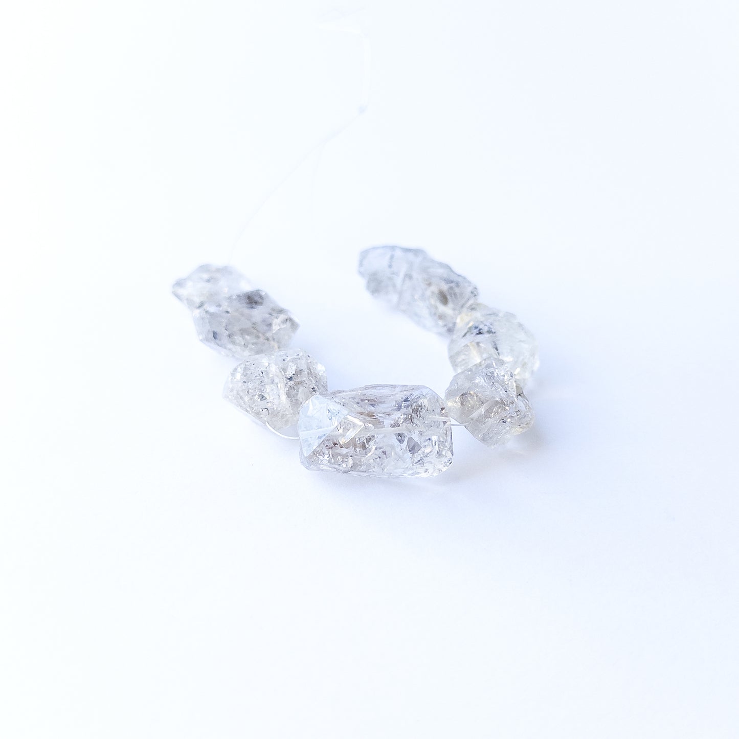 Herkimer Diamond drilled rough gemstone beads showcasing bold clarity and raw sparkle.