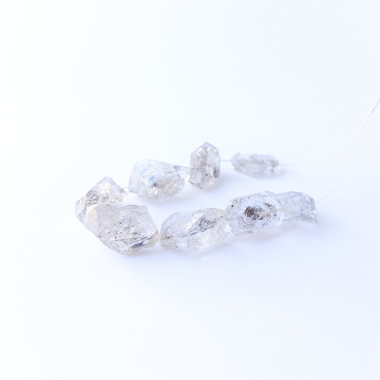 Genuine Herkimer Diamond drilled rough gemstone beads showcasing bold clarity and raw sparkle.