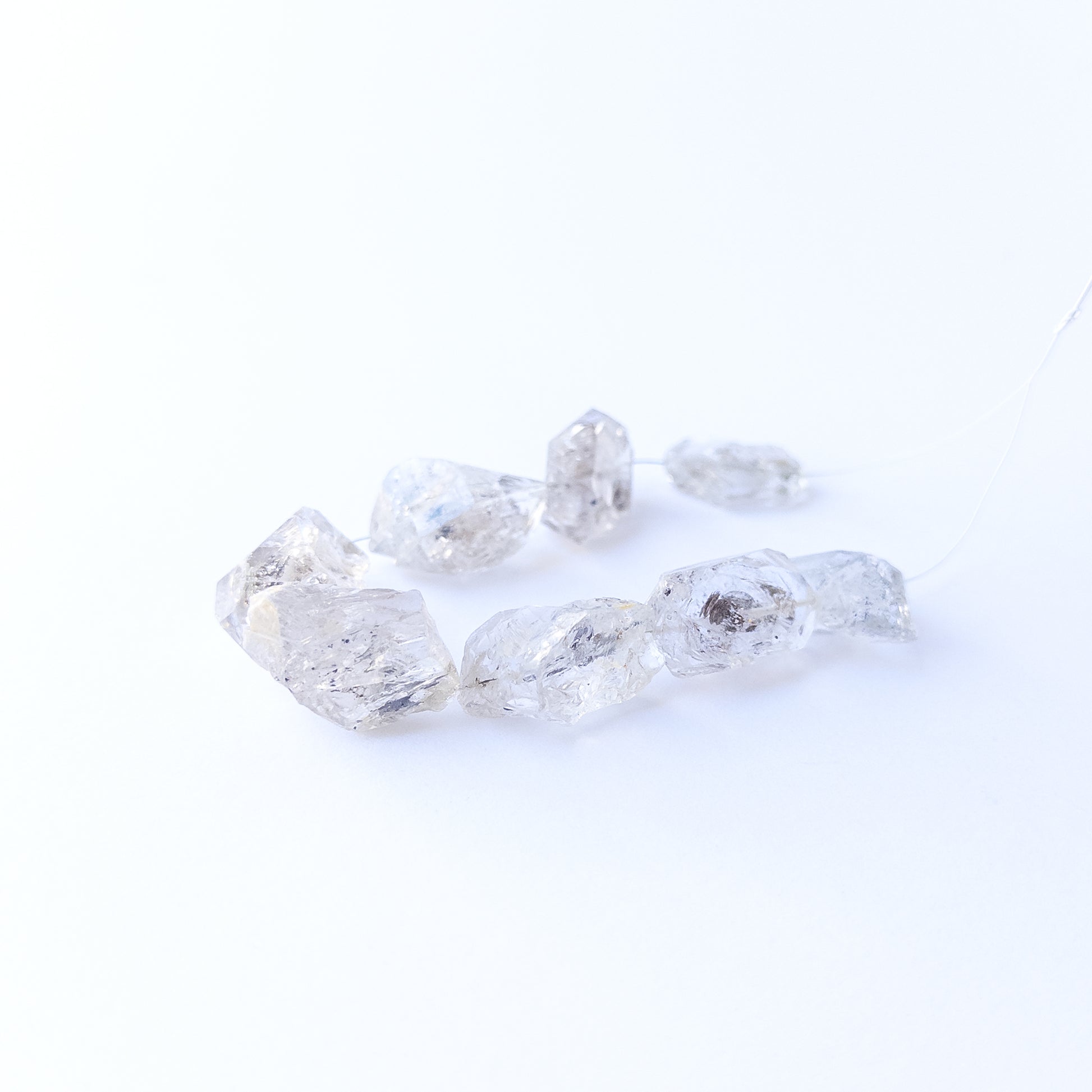 Genuine Herkimer Diamond drilled rough gemstone beads showcasing bold clarity and raw sparkle.